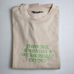 THRIVING, SURVIVING & OCCASIONALLY CRYING Embroidered Sweatshirt