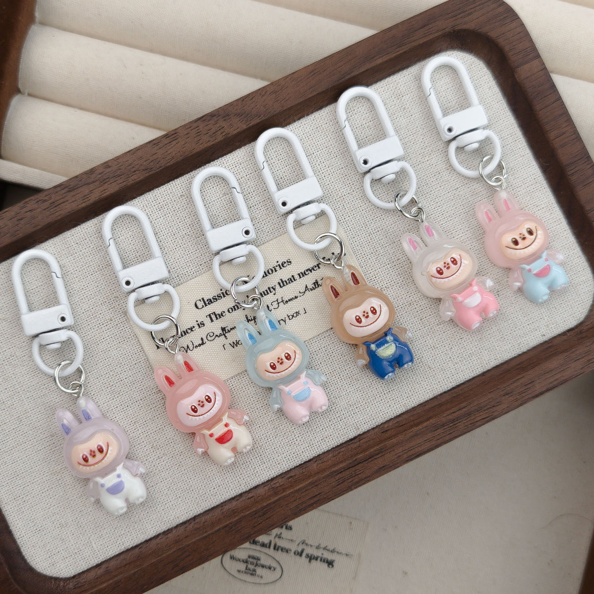 White Buckle Doll Pendant KeyChain